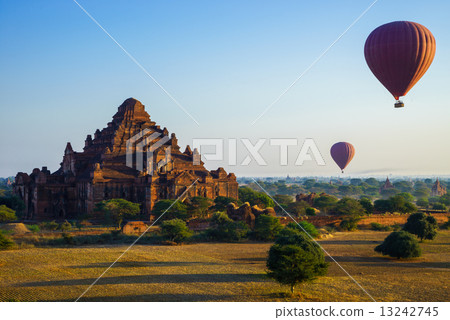Balloon over Dhammayangyi temple at sunrise,  Bagan, Myanmar 13242745