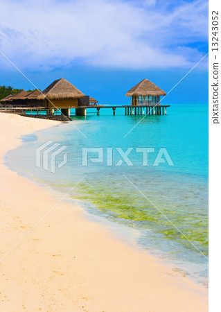 Water bungalows on a tropical island Water bungalows on a tropical island 13243052