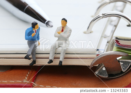 A notebook and a businessman 13243383