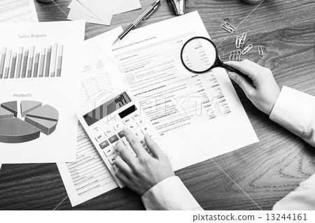 Calculating on the office desk 13244161