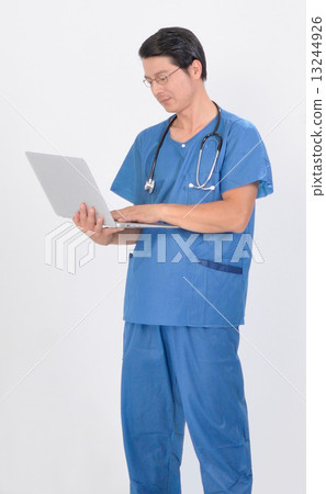 Doctor checking pointing report on laptop 13244926