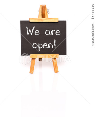 We are open. Blackboard with text and easel. We are open. Blackboard with text and easel. 13245539
