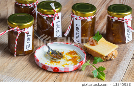 Onion pineapple chutney on rustic wood Onion pineapple chutney on rustic wood 13245928