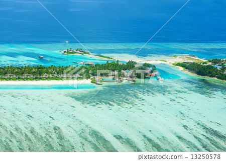 Tropical island on Bora Bora with water villas and coral reef. Tropical island on Bora Bora with water villas and coral reef. 13250578
