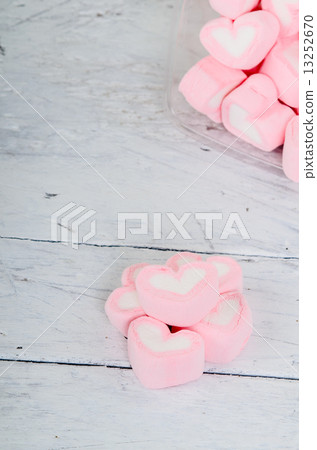 Pink heart shape mashmellow on wooden background. Pink heart shape mashmellow on wooden background. 13252670