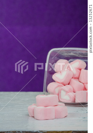 Heart shape mashmellow with purple background. Heart shape mashmellow with purple background. 13252671