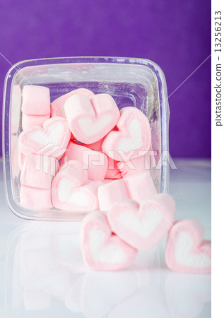Heart shape mashmellow with purple background. Heart shape mashmellow with purple background. 13256213
