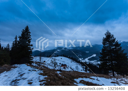 Winter snow covered mountain peaks in Europe. 13256408