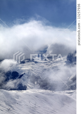 Off-piste slope in fog 13257936