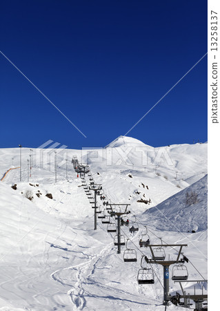 Winter mountains and ski slope at nice day 13258137