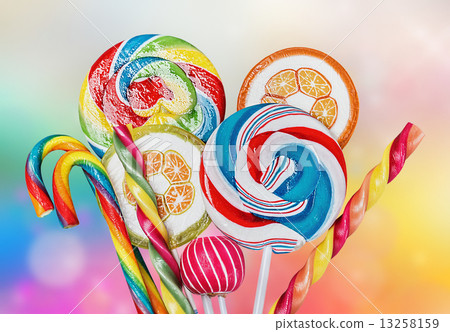 Colorful candies and sweets on a multi-colored background Colorful candies and sweets on a multi-colored background 13258159