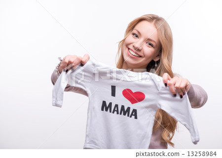 Young attractive woman holding babysuit I love mom isolated on w 13258984