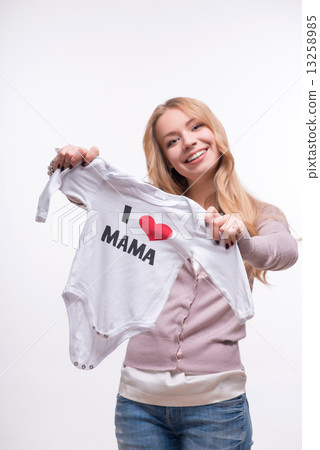 Young attractive woman holding babysuit I love mom isolated on w 13258985