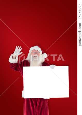 Composite image of santa holds a sign and is waving Composite image of santa holds a sign and is waving 13264098