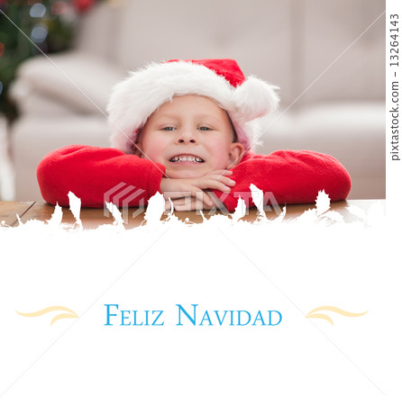 Composite image of festive little boy smiling at camera Composite image of festive little boy smiling at camera 13264143