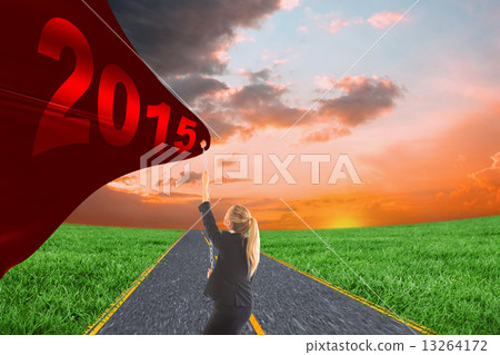 Composite image of businesswoman pulling a chain Composite image of businesswoman pulling a chain 13264172