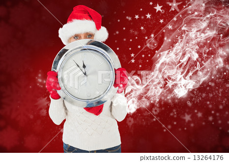 Composite image of festive woman holding clock Composite image of festive woman holding clock 13264176