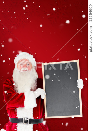 Composite image of santa claus showing blackboard 13264609