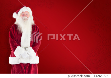 Composite image of jolly santa smiling at camera 13264926