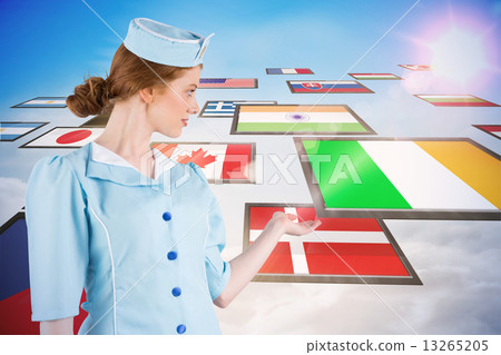 Composite image of pretty air hostess presenting with hand 13265205