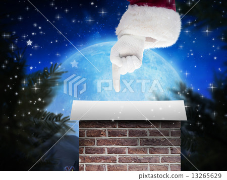 Composite image of santa claus points at something 13265629
