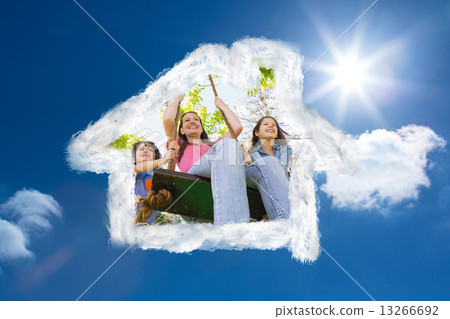 Composite image of kids pushing mother on swing 13266692