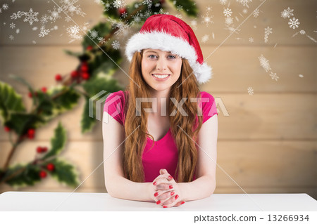 Composite image of festive redhead smiling at camera 13266934