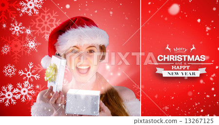 Composite image of sexy girl in santa costume opening a gift 13267125