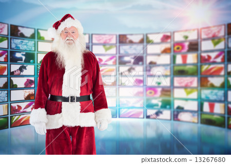 Composite image of jolly santa smiling at camera 13267680