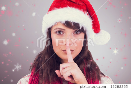 Composite image of portrait of a brunette keeping a secret Composite image of portrait of a brunette keeping a secret 13268265