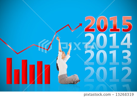 Composite image of businesswoman sitting cross legged cheering 13268319