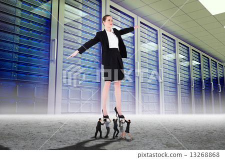 Composite image of business people supporting boss 13268868