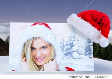 Composite image of pretty girl smiling in santa outfit 13268869