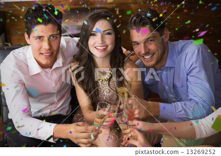 Composite image of stylish friends having a drink together 13269252