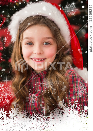 Composite image of festive little girl smiling at camera 13269255