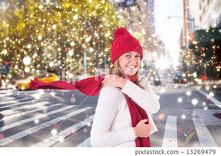 Composite image of happy blonde in winter clothes Composite image of happy blonde in winter clothes 13269479