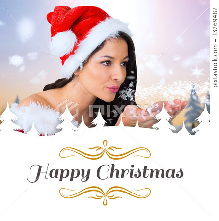 Composite image of pretty girl in santa outfit blowing 13269482