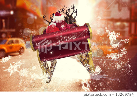 Composite image of santa flying his sleigh 13269784