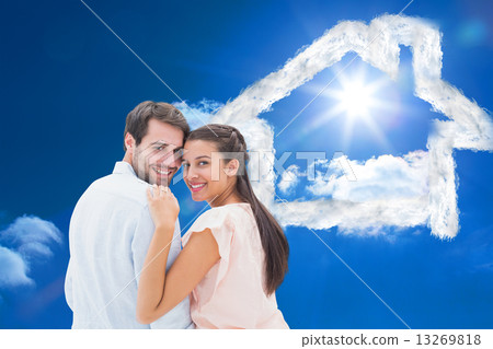 Composite image of attractive young couple smiling at camera 13269818