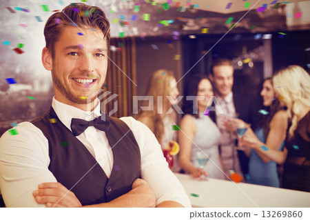 Composite image of handsome barman smiling at camera 13269860