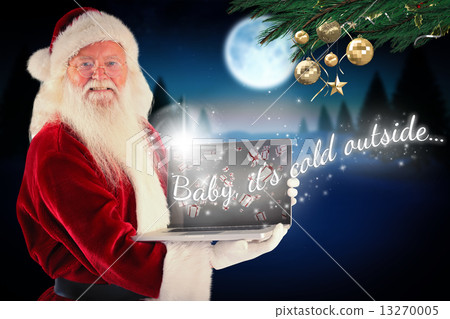 Composite image of santa claus presents a laptop 13270005