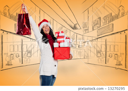 Composite image of smiling woman with christmas presents Composite image of smiling woman with christmas presents 13270295