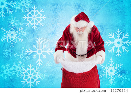 Composite image of santa looks in his bag 13270324
