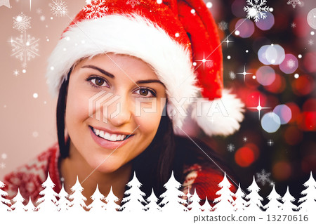 Composite image of festive brunette smiling at camera 13270616