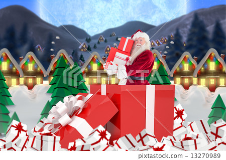 Composite image of santa standing in large gift 13270989