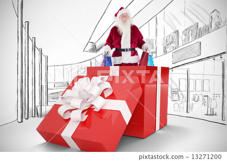 Composite image of santa standing in large gift 13271200