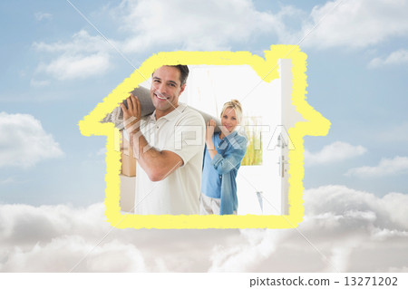 Composite image of couple carrying rolled rug after moving in a Composite image of couple carrying rolled rug after moving in a 13271202