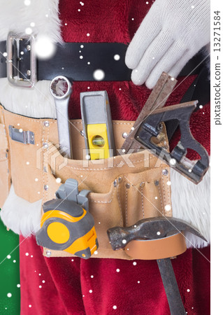 Composite image of father christmas is wearing a tool belt 13271584