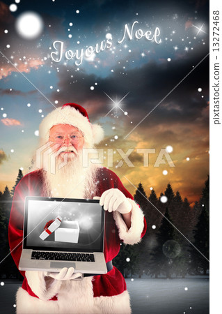 Composite image of santa claus presents a laptop 13272468