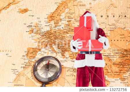 Composite image of santa covers his face with presents 13272756